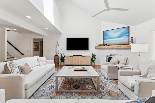 living room with ceiling fan and light hardwood / wood-style floors