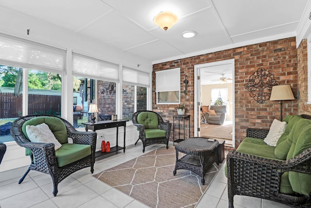 sunroom featuring a ceiling fan