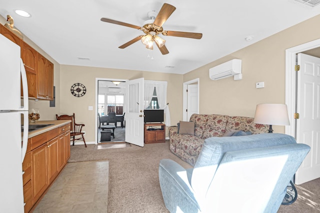 living room with a wall mounted AC, baseboards, visible vents, light carpet, and ceiling fan