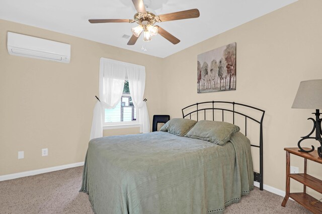 bedroom with baseboards, an AC wall unit, a ceiling fan, and light colored carpet
