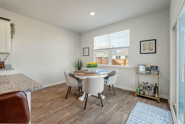 dining space featuring light wood-type flooring