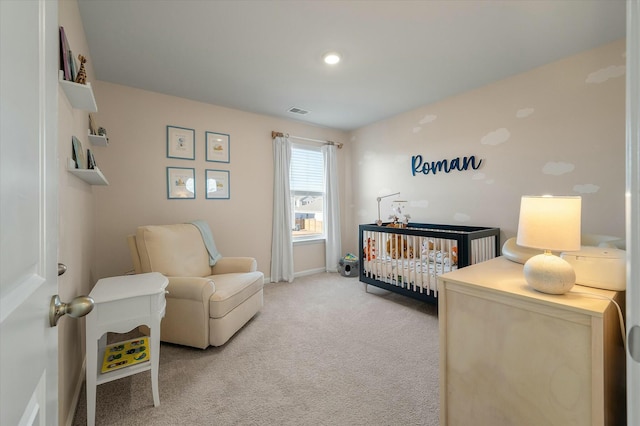 bedroom with light carpet and a crib