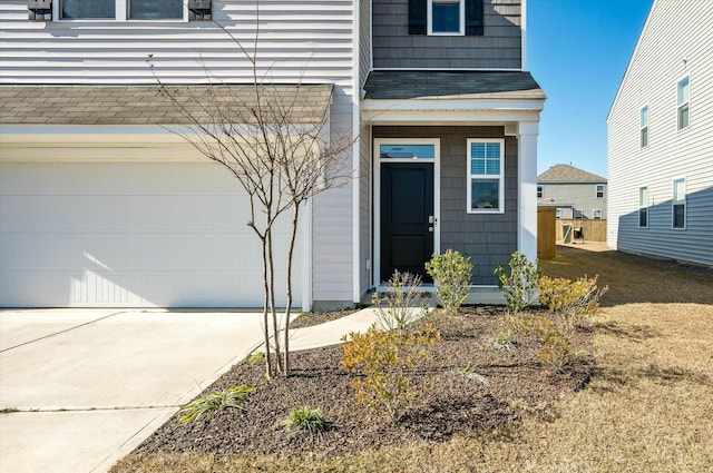 view of exterior entry featuring a garage