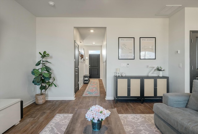 living room with dark hardwood / wood-style floors