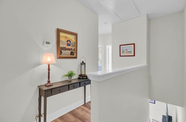 hallway with light hardwood / wood-style floors