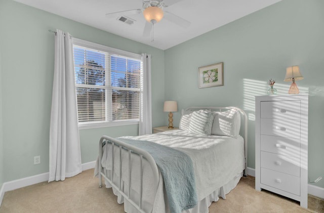 bedroom featuring ceiling fan and light colored carpet