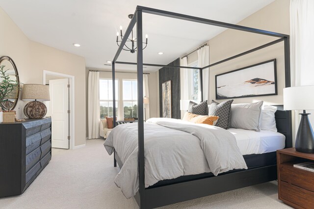 carpeted bedroom with a notable chandelier