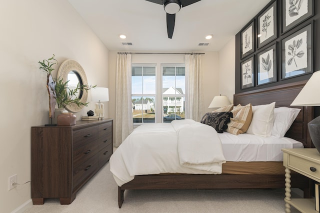 bedroom with ceiling fan and light colored carpet