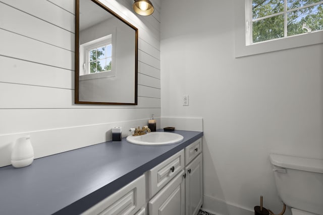half bath with vanity and toilet