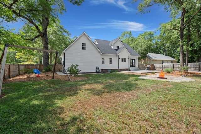 back of property with an outdoor fire pit, a patio area, and french doors