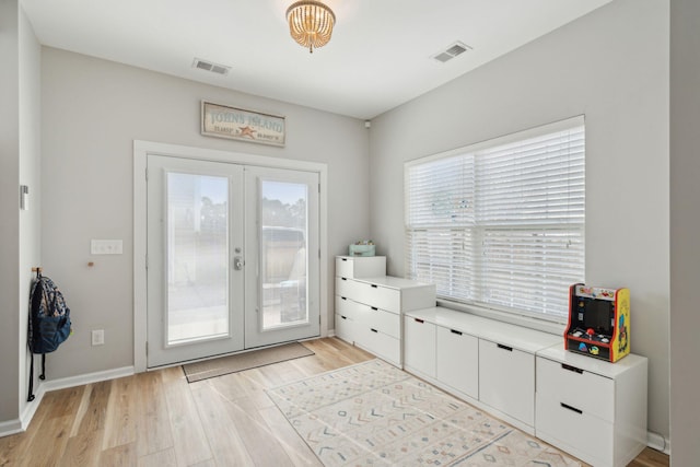 entryway featuring french doors and light hardwood / wood-style floors