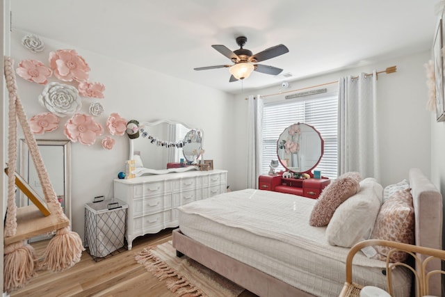 bedroom featuring light hardwood / wood-style floors and ceiling fan