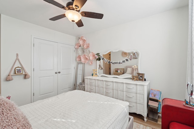 bedroom featuring a closet, ceiling fan, and light wood-type flooring