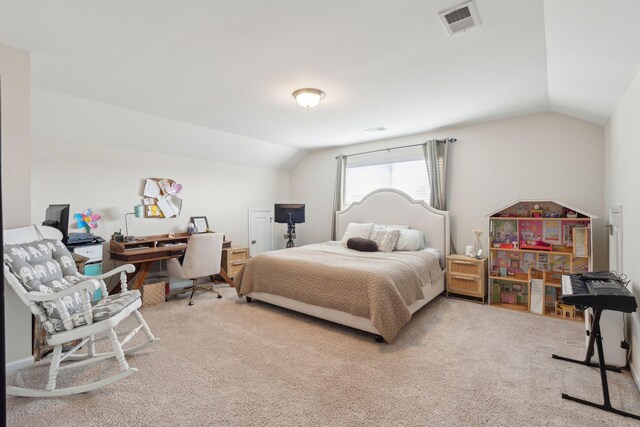 carpeted bedroom with vaulted ceiling