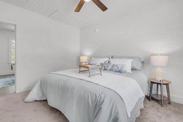 bedroom featuring carpet floors, attic access, and ceiling fan