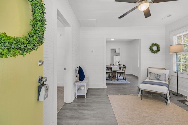 interior space featuring ceiling fan and wood finished floors