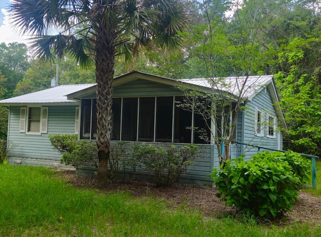 126 Rattlensnake Trl, Walterboro, SC 29488 - ranch-style home with a metal roof and a sunroom