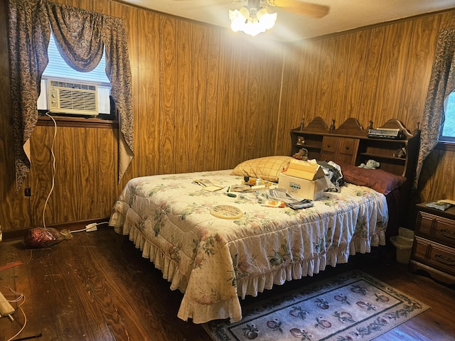 126 Rattlensnake Trl, Walterboro, SC 29488 - bedroom with dark wood-type flooring, wood walls, and a ceiling fan