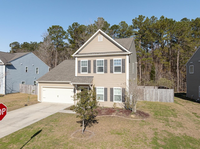 traditional-style home with driveway, an attached garage, fence, and a front yard