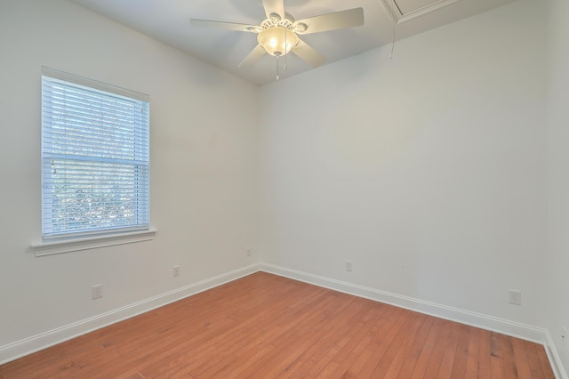 spare room featuring ceiling fan and hardwood / wood-style floors