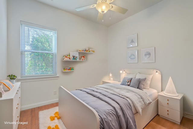 bedroom featuring ceiling fan and light hardwood / wood-style flooring