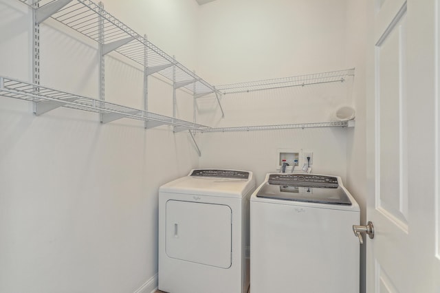 laundry room featuring washing machine and clothes dryer