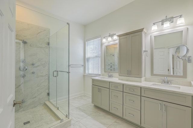 bathroom featuring a shower with shower door and vanity