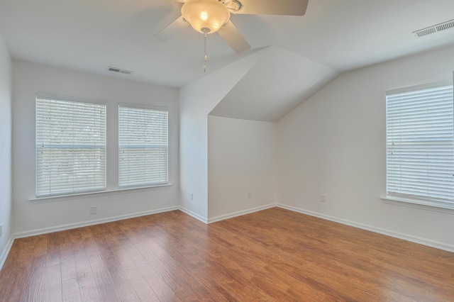 bonus room with ceiling fan, lofted ceiling, and hardwood / wood-style flooring