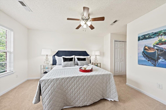 105 Brockman Way, Goose Creek, SC 29445 - bedroom featuring light carpet, multiple windows, a textured ceiling, and a ceiling fan