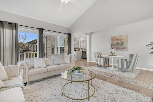 living room with tile patterned floors, high vaulted ceiling, and ceiling fan