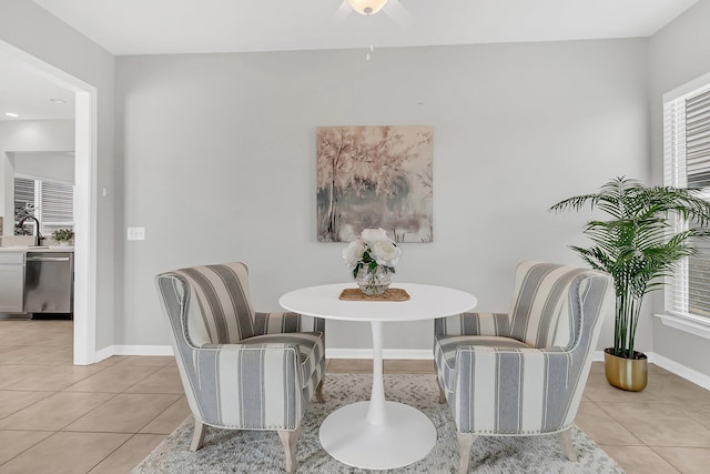 tiled dining room with sink