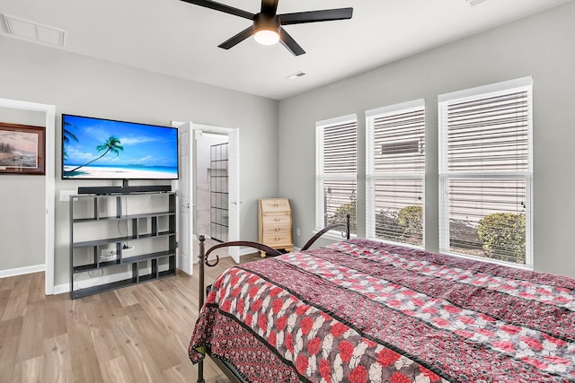 bedroom with ceiling fan and light hardwood / wood-style flooring