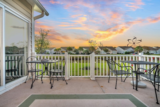 view of balcony at dusk