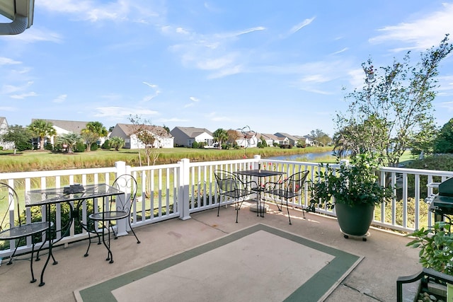 view of patio with a water view