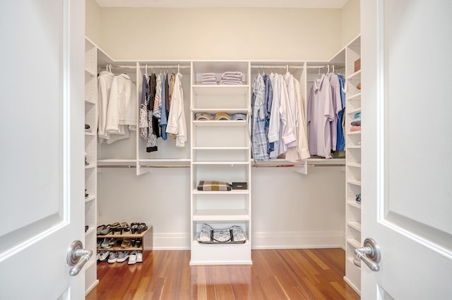 walk in closet featuring hardwood / wood-style floors