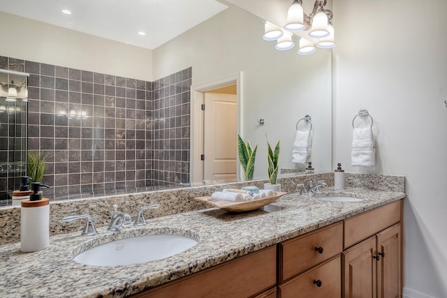 bathroom with vanity and a notable chandelier