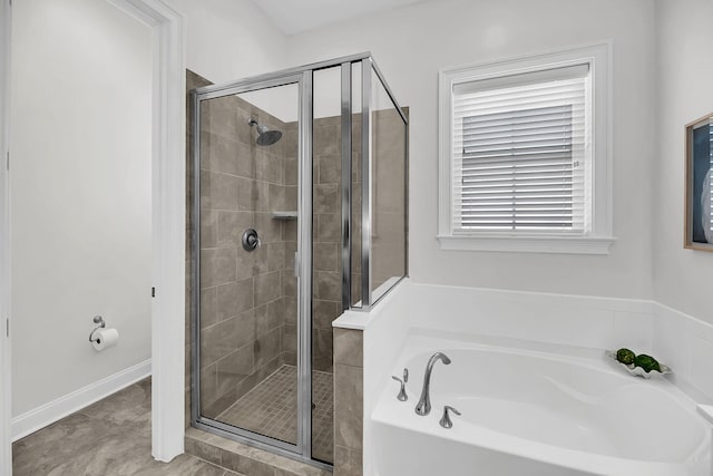 full bathroom featuring a bath, a stall shower, and tile patterned floors