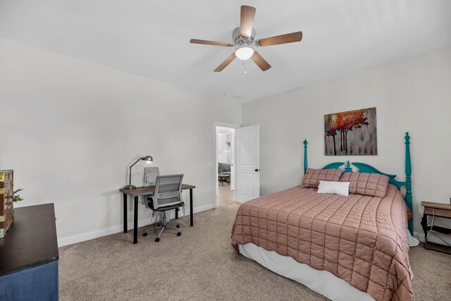 carpeted bedroom with baseboards and a ceiling fan