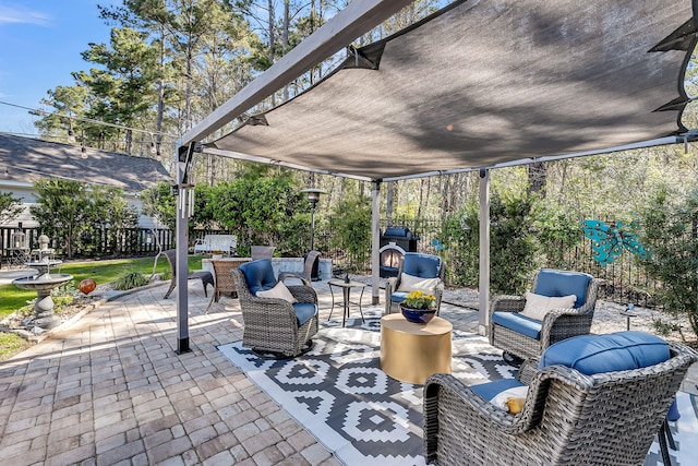 view of patio with fence and outdoor lounge area