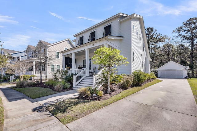 view of front of house with covered porch, an outdoor structure, and a garage