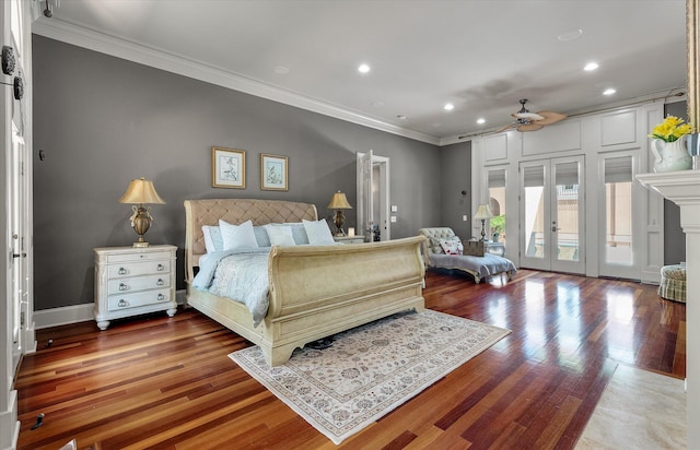bedroom with crown molding, recessed lighting, access to exterior, wood finished floors, and french doors