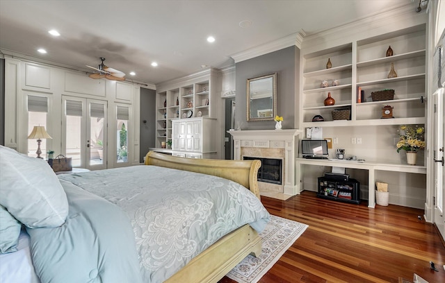 bedroom featuring french doors, ornamental molding, recessed lighting, and a premium fireplace