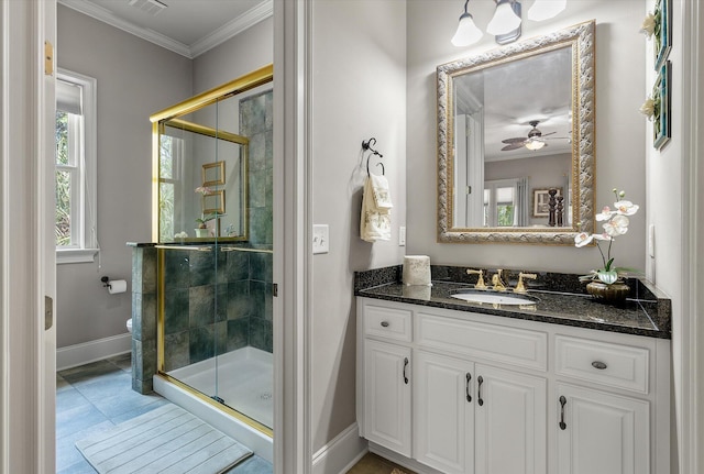 bathroom featuring crown molding, a shower stall, vanity, toilet, and baseboards