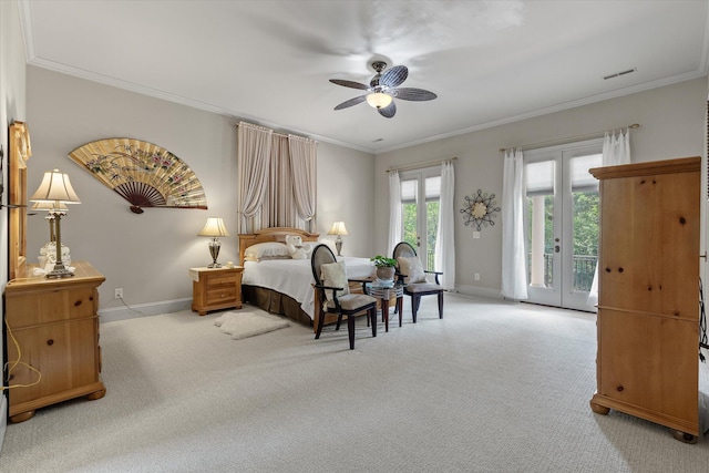 carpeted bedroom featuring access to outside, baseboards, ornamental molding, and visible vents