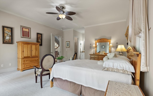 bedroom featuring crown molding, ceiling fan, carpet, connected bathroom, and baseboards