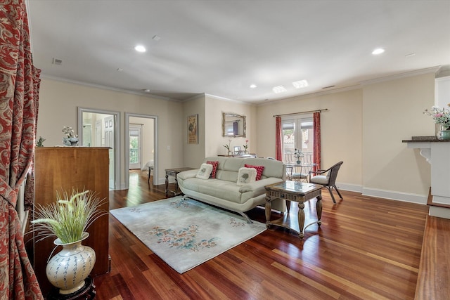 living area with baseboards, crown molding, recessed lighting, wood finished floors, and french doors
