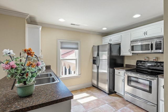 kitchen with recessed lighting, white cabinetry, crown molding, visible vents, and stainless steel appliances
