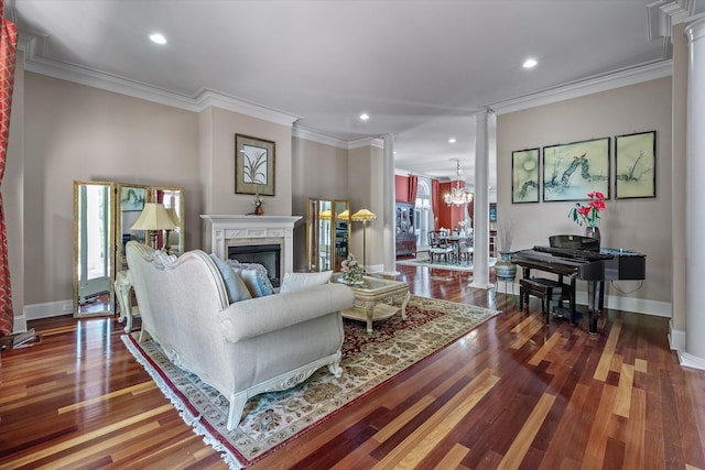 living room featuring ornate columns, a high end fireplace, baseboards, and recessed lighting