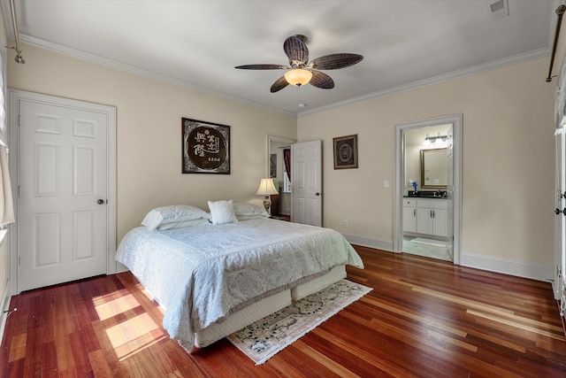 bedroom featuring ornamental molding, wood finished floors, and visible vents