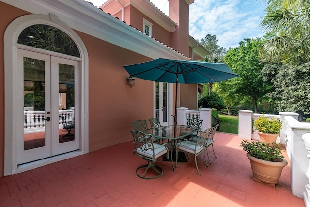 view of patio featuring french doors and outdoor dining area